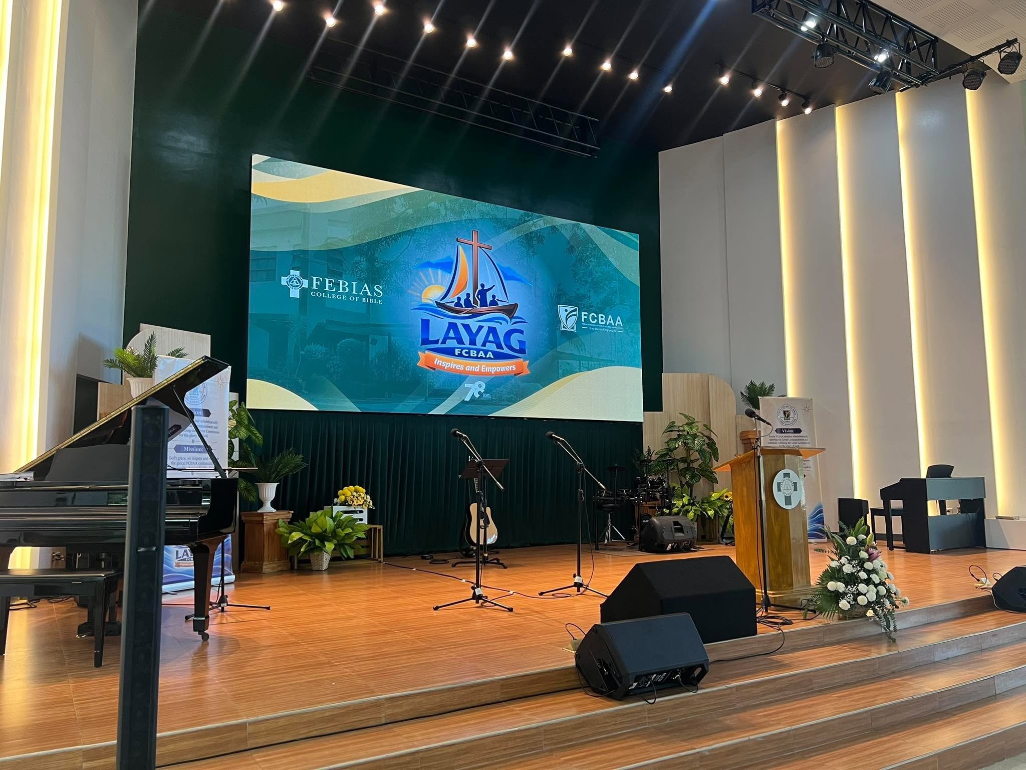 The Vision Chapel stage set and ready — LAYAG FCBAA logo on the big screen