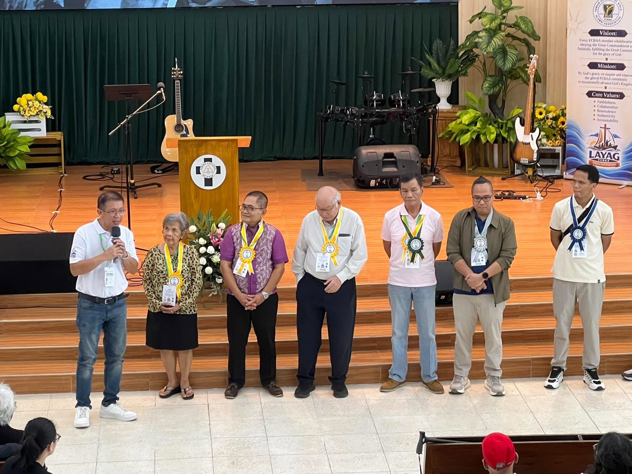 Jubilarians and honorees recognized on stage during the awards ceremony